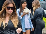 The gym is paying off! Khloe Kardashian shows off her pert posterior as she and sister Kourtney leave a market in New York