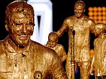 It's Golden goo! David Beckham and sons Romeo and Cruz gets gunked in slime at Nickelodeon Kids' Choice Sports Awards