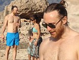 Gettin' Over You: David Guetta takes a beach break with his two children and a mystery brunette in Ibiza