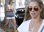Ageless figure: Elizabeth Berkley, 41, showed off her toned legs in tiny white shorts as she strolled around West Hollywood, California on Friday