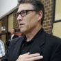 The land of the free and the home of the brave: Texas Gov. Rick Perry, pictured here participating in the national anthem on Saturday, is expected to announce this afternoon that he is deploying the Texas National Guard to the state's southern border, which is also the U.S. border with Mexico