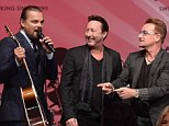 Who will pay $1million for this guitar? U2 legend Bono put his guitar up for auction after his performance with Julian Lennon