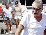 The high life! Roberto Cavalli, 73, sports denim hotpants as he takes his pooches for a stroll with girlfriend Lina Nilson, 26, in Ibiza