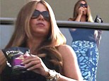 So that's her secret! Sofia Vergara snacks on healthy crisps while taking in view from hotel balcony on trip with Joe Manganiello