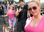 Animal lover: Coco Austin enjoyed some canine companionship on Sunday as she attended a concert in Connecticut where husband Ice-T was performing