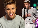 Justin Bieber tries to clean up his tarnished image as he's named Champ Of Charity at Young Hollywood Awards