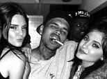 Who knew they were friends? Kendall and Kylie Jenner were seen partying with Chris Brown on Saturday night, also pictured rapper Trey Songz (left)