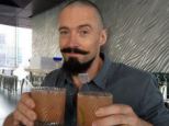 Character development? Hugh Jackman lets his pirate side come out as he enjoys a beverage and sports crazy facial hair
