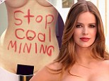 Naked truth: Full-figured model Robyn Lawley uses red lipstick to scrawl political slogan on bare stomach as she says, 'I want people to read this - one way or another'