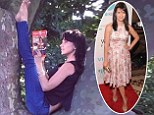 Tree pose: Hilaria Baldwin climbed a tree on Tuesday for her yoga pose of the day