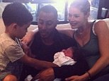 Baby joy: Doutzen Kroes shared this family portrait on Instagram on Wednesday