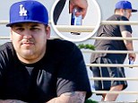 Rob Kardashian surfaces in Malibu with caloric Red Bull looking none too fit... after Khloe admits she feels 'bad' about exposing him to 'dark' times