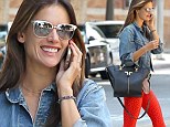Not afraid to stand out, is she?: Model Alessandra Ambrosio steps out in mirrored sunglasses and very bright orange leggings as she heads to workout