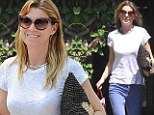 Ellen Pompeo arrives at celebrity hair salon sporting scraggly locks before emerging transformed with bouncy curls