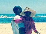 'My favorite hue is Jay Z Blue': Beyonce posted a heartwarming Instagram snap on Monday of her husband cradling their daughter Blue Ivy on a picturesque beach