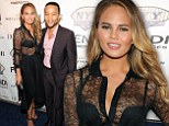 Sexy: Chrissy Teigen showed off her slim figure in a see-through blouse, as she and her husband John Legend attended a DuJour Magazine and NYY Steak event honouring Chrissy in New York City on Monday