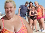 Socks on the beach! Swimsuit-clad Mama June shows off 100lb weight but still hides that 'forklift foot' on Florida holiday with Honey Boo Boo clan