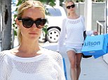 Shop til you drop! Kristin Cavallari carries four bags from Kitson as she enjoys a solo outing without her boys
