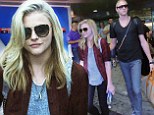 Aren't you hot? Chloe Moretz dresses for the winter in flannel shirt and jeans as temperatures climb
