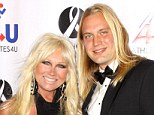 Drama: Linda Hogan's ex boy toy, Charlie Hill, is suing her for $1.5 million for menial labour he performed during their relationship - pictured together in LA in November 2010
