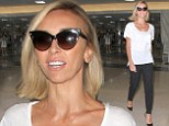 Jet-set style! Giuliana Rancic is casual chic in white T-shirt and pumps as she arrives at LAX