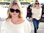 Can she do no wrong? Kate Upton turns on the sex appeal in skinny jeans and white top while catching a flight at LAX