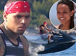 Chris Brown has reportedly been dumped by girlfriend of three years Karrueche Tran.
So it appears the 25-year-old spent his Friday trying to distract himself from the breakup with some time well spent on a luxury yacht off the coast of the French Riviera.
When he wasn't smoking cigarettes while lounging on the back of the massive vessel, the Don't Wake Me Up singer was seen speeding around the Mediterranean waters on a black jet ski.