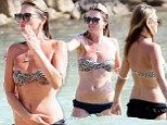 Never in the shade! Kate Moss looks trim in leopard print bikini as she cools off in the sea with daughter Lila Grace during Ibiza break with Jamie Hince
