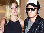 New girlfriend? James Franco is spotted rushing through LA airport with beautiful mystery blonde who shows off her legs and midriff in tiny Daisy Dukes