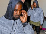 Leaving a message for Kim? Kanye West looks sad as he chats on phone after leaving family behind to jet out to Singapore