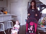 She's learned from the best! Hilaria Baldwin watches as her adorable baby daughter Carmen strikes a standing yoga pose