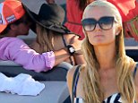Blossoming romance: Paris Hilton has been keeping the company of a new mystery love interest while on vacation in Ibiza - pictured together on Saturday