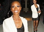 A smiling Brandy shows off her toned legs in a black lace mini skirt and crisp white blazer while out in LA