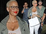 Amber Rose shows off her décolletage in low-cut pink tank top as she exits the Beyoncé and Jay Z concert without husband Wiz Khalifa