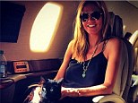 Heidi Klum shows off new feline friend on her private jet after visiting artist Donald Judd's museum in Texas