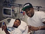 Visitor: Floyd Mayweather went to see Paul George in hospital after he suffered a broken leg