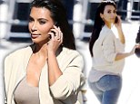 Did you call the 'booty tailor'? Kim Kardashian lets her jeans do the talking as she arrives for appearance on Jimmy Kimmel