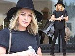Hilary Duff cuts a fashionable figure in an all-black ensemble featuring a large black fedora as she shops in Beverly Hills