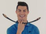 The winning smile: Cristiano Ronaldo gives the facial muscle exerciser his blessing in the bizarre video