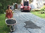 Helping hand: Householders paying for a new drive might expect their workers to be burly builders, but model Daisy Lowe was spotted doing the dirty work while with friends in America