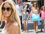 The Pilates has paid off! Denise Richards displays toned legs in playsuit as she shops with daughters Lola and Sam