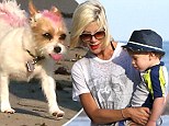 Tori Spelling brings along her pooch with a pink streak dyed on coat as she spends a family day at the beach in Malibu