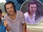 Harry Styles dashes through the pouring rain in a drenched white T-shirt... but still stops to pose for photos with his fans