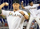It takes two! Kellan Lutz and Antonio Banderas join forces to throw ceremonial first pitch at Miami Marlins game