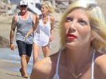 Life's a beach! Tori Spelling and Dean McDermott continue to put on a united front as they spend a day with their children