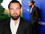 Leonardo DiCaprio ties his long locks back in a bun and sports scruffy beard as special guest at environmental event
