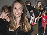Brooke Mueller couldn't be happier as she jets into LAX with twins Bob and Max, four months after regaining custody following 2012 overdose