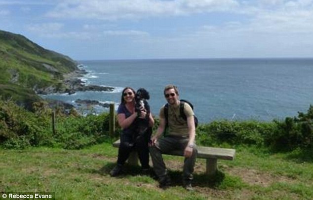Enjoying a walk along the coast: Rebecca and husband Adrian stop for a picture with their beloved dog Bess