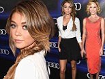 Sarah Hyland plays the coquette in bra-baring blouse and little black skirt with radiant in orange Julie Bowen at Audi Pre-Emmy party