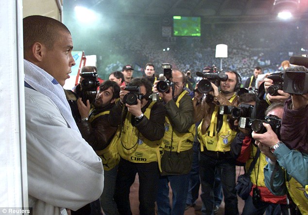 The one they all want: Ronaldo, pictured in the Olympic Stadium before the first leg of the Italian Cup final against Lazio in 2000,  was always the centre of attention when he was at the peak of his powers